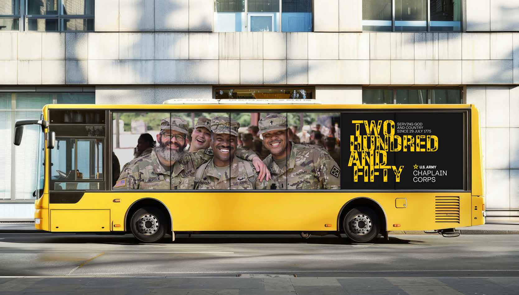 Banner on the side of a yellow bus. Banner shows a photograph of soliders with the title "Two Hundred and Fifty"
